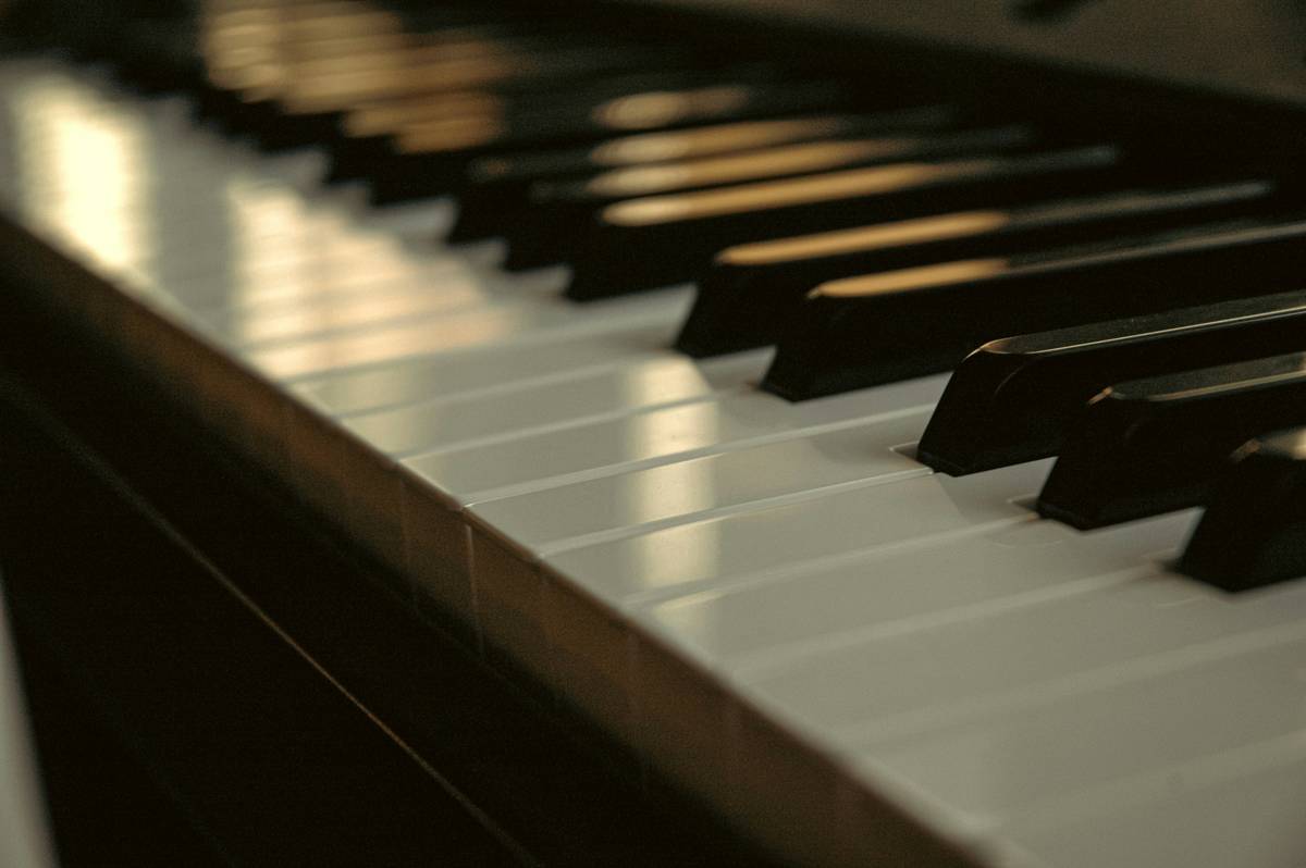 Hands practicing simple piano exercises for beginners on keyboard focusing on finger independence