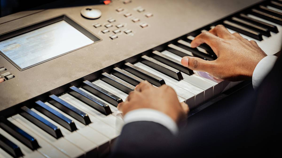 basic music theory for beginners illustrated on a piano keyboard with labeled notes and staff notation